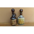 Pair of beautiful old wrapped bottles.