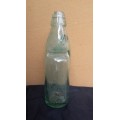 Old glass bottle with marble inside.