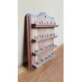 Lovely little wooden thimble rack.