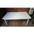 Lovely, large white, wooden table.