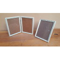Set of 3 white & gold framed photo frames.