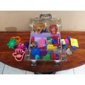 Collection of kids plastic dough cutters and moulds.