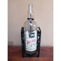 Large White Horse whiskey bottle on a stand.