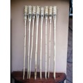 Collection of 8 cane outdoor candle sticks.