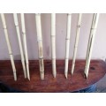 Collection of 8 cane outdoor candle sticks.