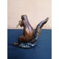 Solid bronze squirrel, sculpture by Sarah Richards.