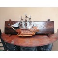 Lovely mounted wooden sailing ship.
