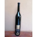 Very tall, slim cabenet sauvignon bottle.