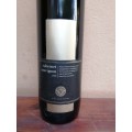 Very tall, slim cabenet sauvignon bottle.