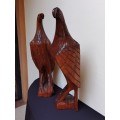 Large pair of solid wood carved eagles.