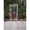 White metal and glass stand.