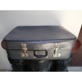 Large grey expandable vintage suitcase.