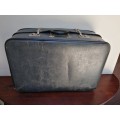 Large grey expandable vintage suitcase.