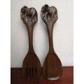 Two beautiful pairs of wooden salad utensils.