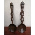 Two beautiful pairs of wooden salad utensils.
