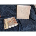 Pair of old parchment scrapbook albums.