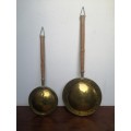 Stunning pair of old brass bed warmers.