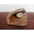 Lovely vintage baseball mitt and ball.