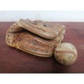 Lovely vintage baseball mitt and ball.