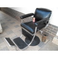 Old barber chair no hydraulic center leg and mounted on a modern bar stool leg