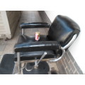 Old barber chair no hydraulic center leg and mounted on a modern bar stool leg