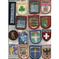 Lot of 22 embroidered cloth badges.