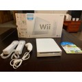 Nintendo wii console with remotes and wii sports