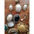 Large collection of vintage and costume jewelry. Some silver earrings.