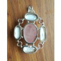 Beautiful sterling silver ladies pendant with stones.