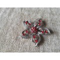 Chrome Plated Flower with Red Glass stones Broach