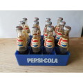 miniature Pepsi cola bottles in crate