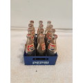 miniature Pepsi cola bottles in crate
