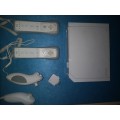 NINTENDO WII WITH 2 CONTROLLERS AND 2 NUNCHUCKS AND TOP SHOT ELITE