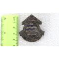 South African National Defence Force Ordnance Corps Cap Badge Lugs Intact 45 x 42 mm