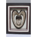 Box framed 3D African head carved from stone