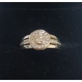 18ct White gold diamond halo ring c/w channel set diamonds on the sides