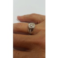 18ct White gold diamond halo ring c/w channel set diamonds on the sides
