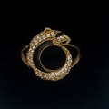 A diamond/black enamel and gold ring copy from the Cartier Jaguar Collection