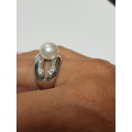 Sterling silver ring with a pearl and small zirconias