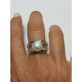 Sterling silver ring with a pearl and small zirconias