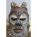 African wood and material carved tribal mask head