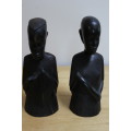 A pair of small African carved wooden figures