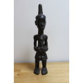 Central African carved wooden figure of a mother holding her baby