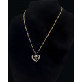 3.6 grams   Total Weight 9 carat Yellow Gold Chain and Cubic Zirconia Heart Pendant