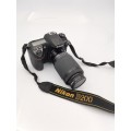 NIKON D2000 CAMERA WORKING COMPLETE WITH CHARGER AND LENSE PLEASE NOTE THE BATTERY COVER IS LOSE!!!