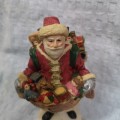 Vintage Santa Claus Figurine with gifts, ideal as shop window decor