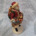 Vintage Santa Claus Figurine with gifts, ideal as shop window decor