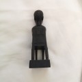 Ebony Vintage Wood carving figure of boy sitting in chair. Solid, smooth finish with amazing detail.