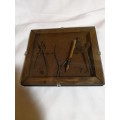 Antique Tools in small box frame. Divider, pliers, compass