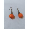 Eye catching, arty hanging orange bead earrings